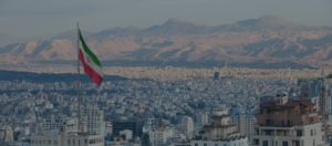 Waving Iran flag above skyline of Tehran. Hamas leader Assassinated. iran's response