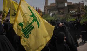 People with Hezbollah flags